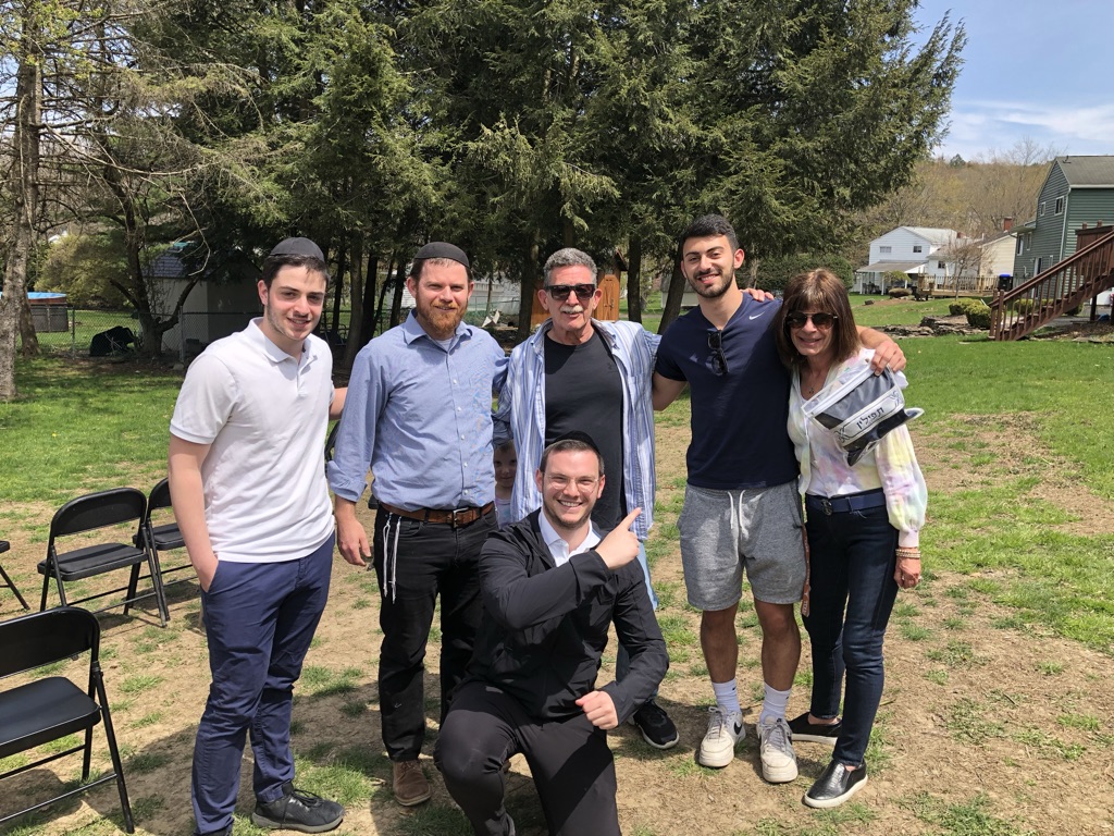 The first official Tefillin Project giveaway, to Jason at Binghamton University with Rabbi Ben Menorah of JLIC, May 2022.